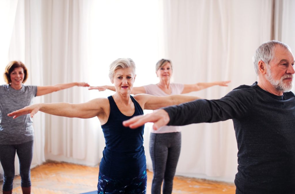 Seniors keeping active in their community through yoga activities.